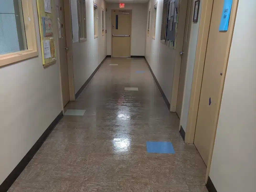 Janitorial services — school hallway floor shining