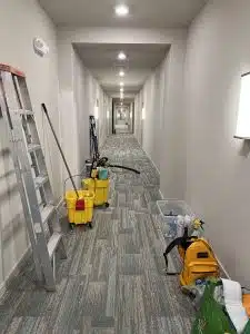 Building hallway with supply carts — janitorial services; day porter